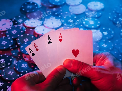 Preview: men's hands hold aces cards against the background of playing chips. the photo shows smoke