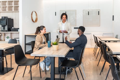 Preview: Business team meeting in modern office discussing project strategy