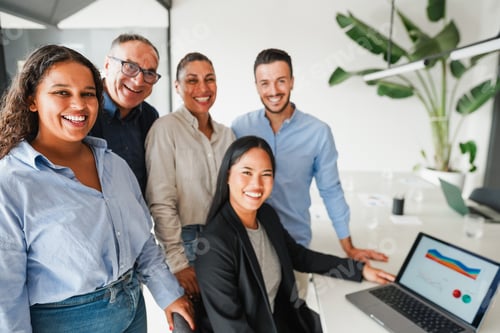 Preview: Multiracial business people smiling on camera inside company office