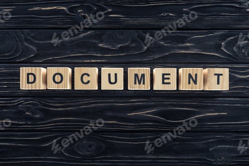 Preview: top view of word document made of wooden blocks on dark wooden tabletop