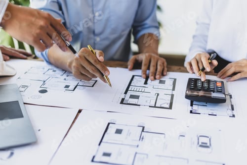 Preview: Architects and engineers discuss building blueprint design and construction project planning.