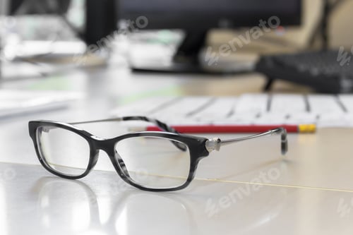 Preview: Office Desk Still Life with Eyeglasses and Pencil