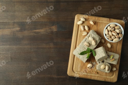 Preview: Concept of tasty food with halva on wooden background