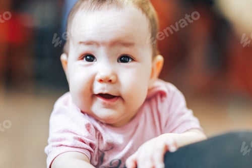 Preview: A Baby girl in pink bedding at home look nice
