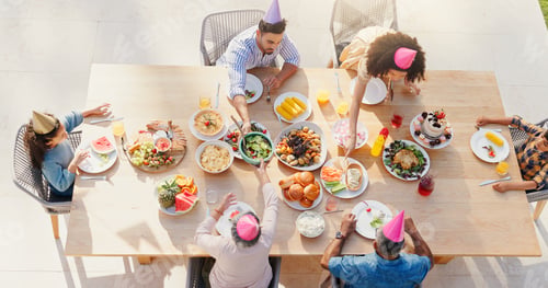 Preview: Happy family, above and birthday party in garden with love, sharing and eating to bond together for