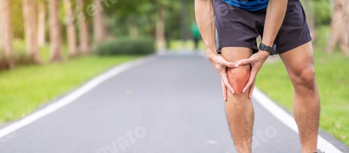 Preview: Young fitness man holding his sports leg injury, muscle painful during training.
