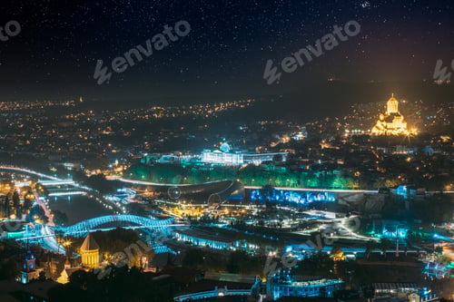 Preview: Tbilisi, Georgia. Amazing Bright Starry Sky Above Justice House, Bridge Of Peace, Concert Hall In
