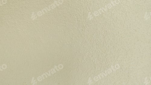 Visualização: Textura de fundo de close-up de parede de estuque pintada de creme bege claro