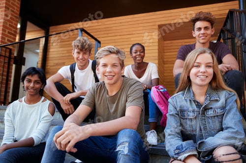 Preview: Group Of Teenage Students Socialising On College Campus Together