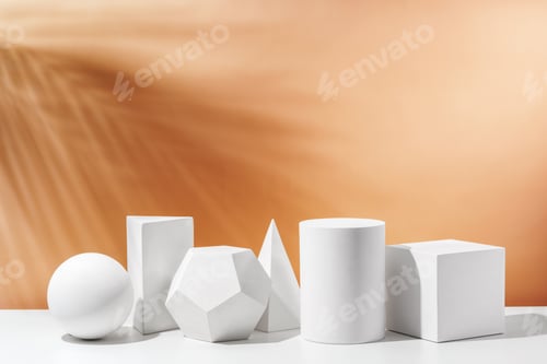 Preview: Various geometric shapes arranged artistically on a table with a warm, soft background during