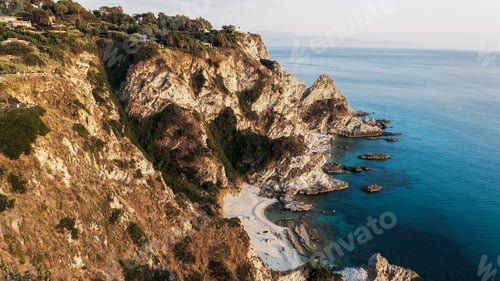 Preview: Cliff on the turquoise sea at sunset