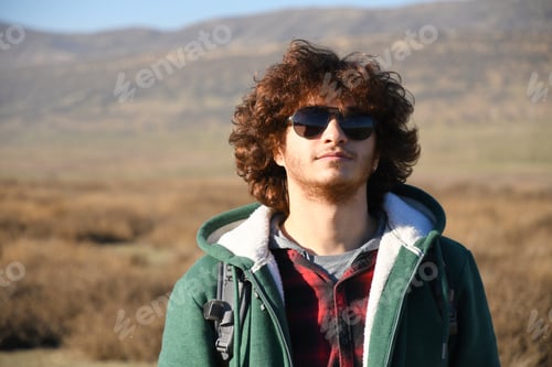 Preview: Young Man Poses in Rural Landscape Outdoors