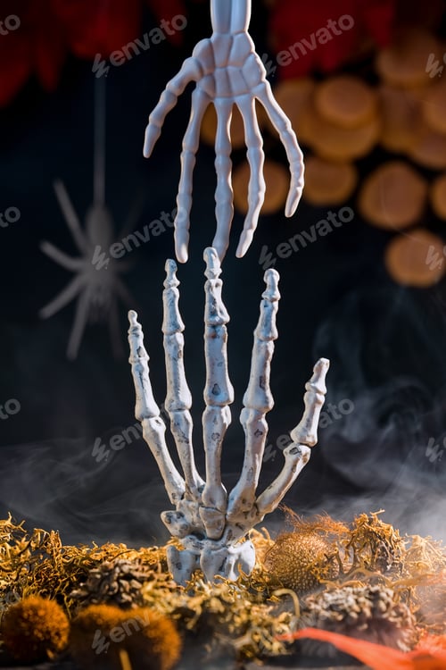 Preview: Hands of skeletons reaching for each other appearing from moss surrounded by misty haze.