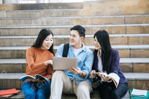 Preview: Group students studying researching on laptop Together sitting at college.