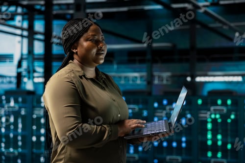 Preview: Data center engineer conducting tests on equipment using software