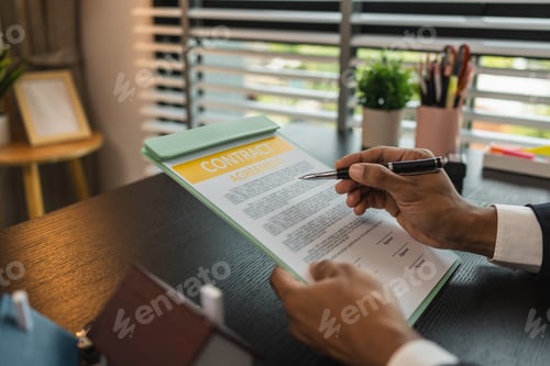 Preview: a real estate agent is explaining the details of a home purchase contract to a buyer
