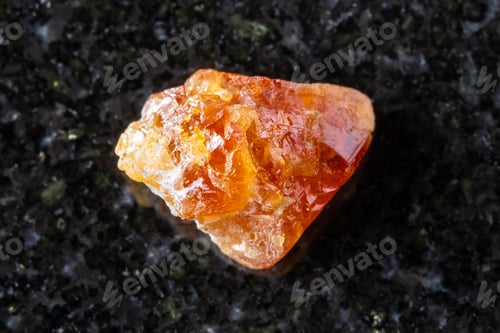 Preview: sample of unpolished scheelite mineral on black