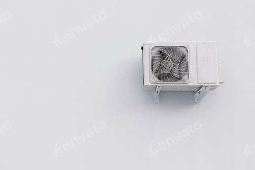 Preview: Outdoor air conditioner split system unit on white wall with copy space