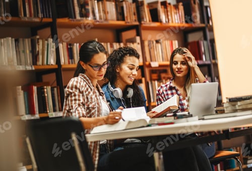 Preview: Group of female students study in the college library.
