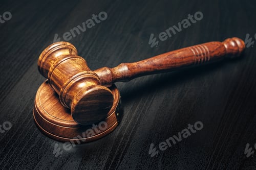 Preview: Wooden mallet on black wooden table close up