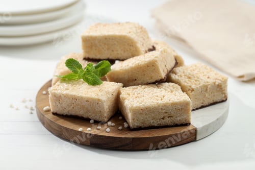 Preview: Delicious puffed rice bars and mint on white wooden table, closeup