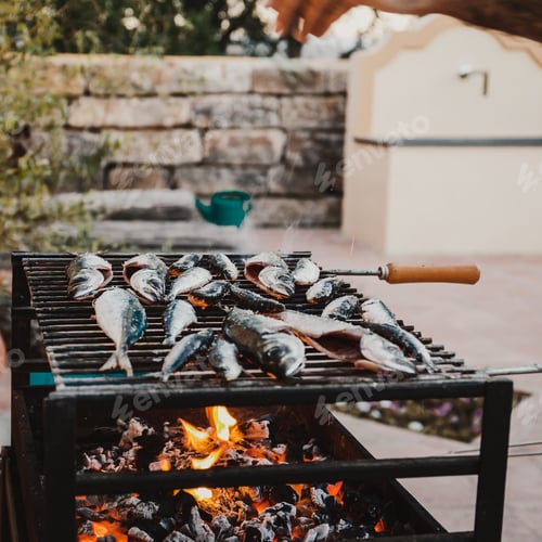 Preview: Fresh fish sadrines on a grill, summertime backyard dinner concept