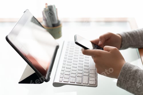 Preview: Girl studying from home with computer and mobile phone