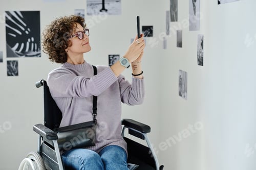 Preview: Woman photographing pictures on smartphone
