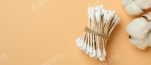Preview: Cotton swabs and cotton on beige background