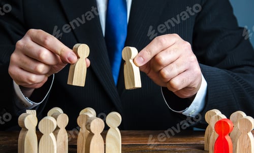 Preview: A businessman evaluates candidates for employment.