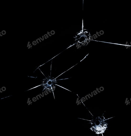 Preview: three bullet hole in glass close up on black background