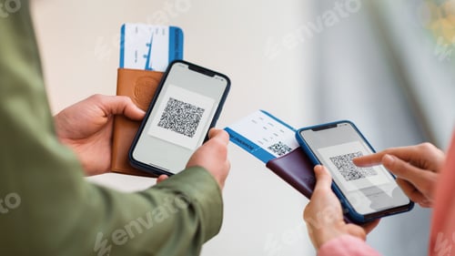 Preview: Tourists Holding Smartphones With Covid Certificate QR Code Indoor, Cropped