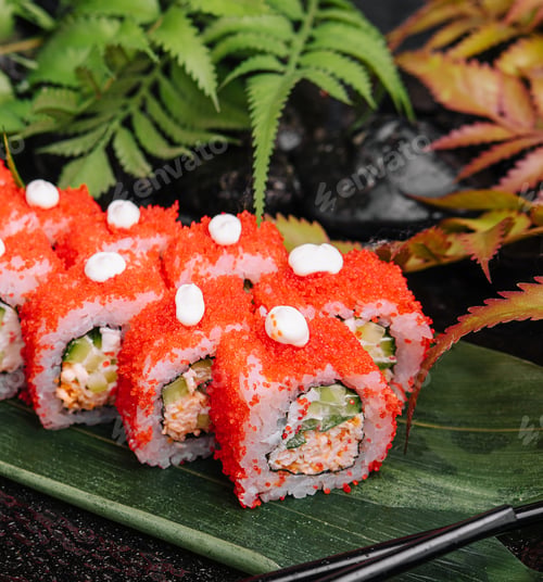 Preview: California Sushi roll cutting on a bamboo leaf