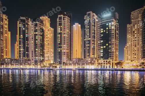 Preview: Night view of high-rise buildings of residential district in Dubai Marina. Dubai Marina Towers