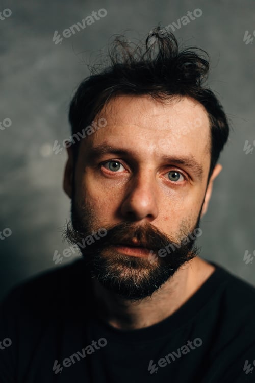 Preview: Portrait Of A Courageous Guy With A Beard And Mustache On A Canvas Background