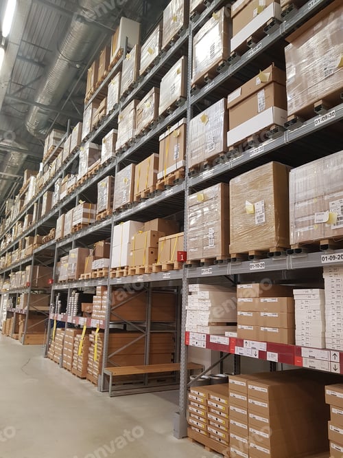 Preview: Racks with boxes in a hypermarket warehouse