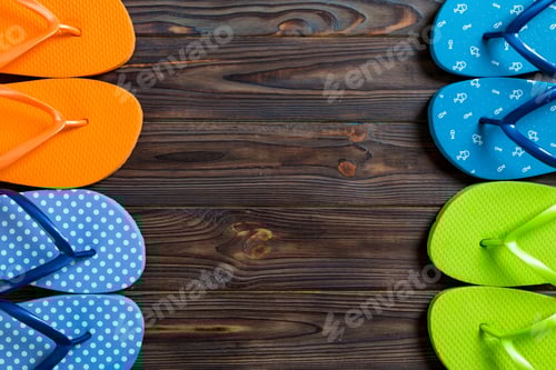 Preview: a lot of flip flop colored sandals, summer vacation on wooden background, copy space top view