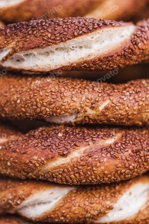 Preview: Turkish bagel simit close up. Fresh baked pastries for sale on the streets