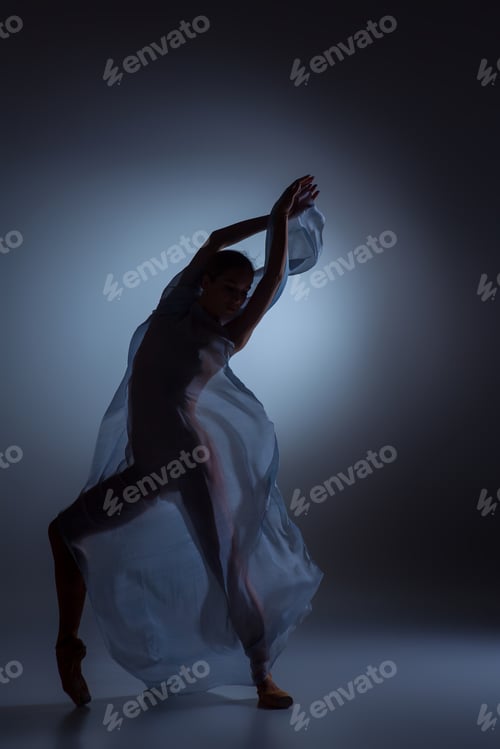 Preview: The Beautiful Ballerina Dancing With Blue Veil On Dark Blue Background
