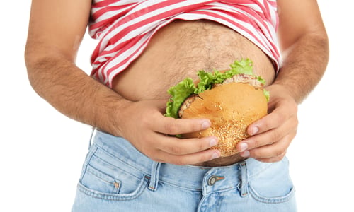 Preview: Overweight man with hamburger on white background, closeup
