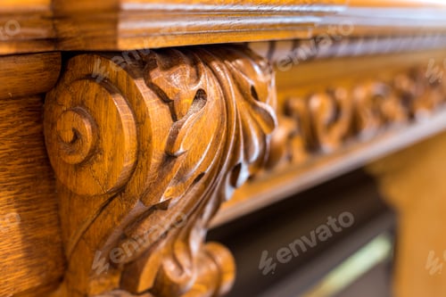 Preview: Close-up detail of carved wooden decorative piece of furniture with floral ornament