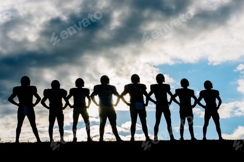 Preview: Silhouette of group of young american football players, standing in row, hands on hips