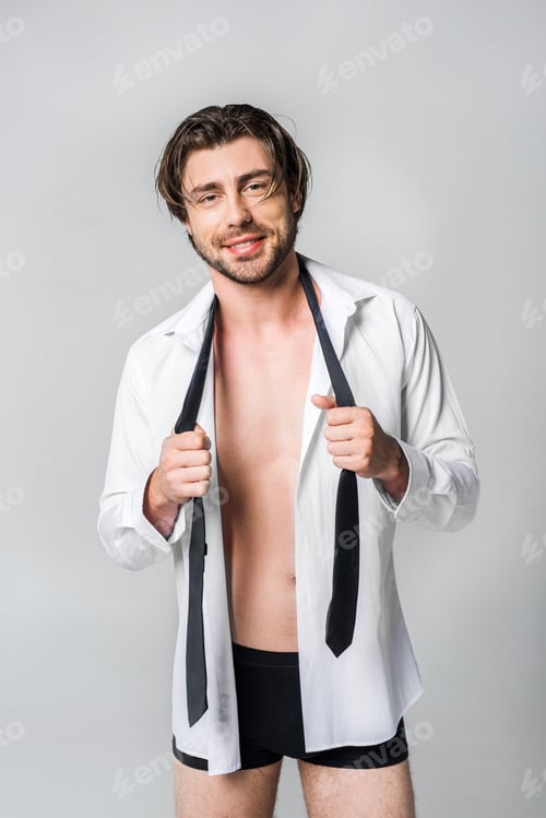 Preview: portrait of smiling stylish young man in white shirt with black tie isolated on grey