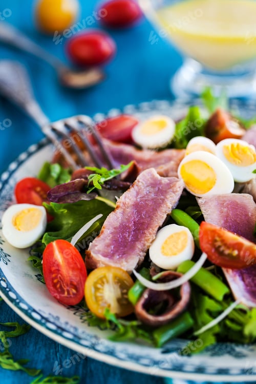 Preview: Tuna salad with tomatoes, boiled eggs, onion, anchovy and lettuc