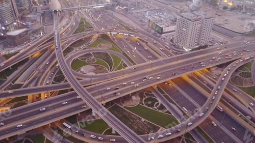 Preview: Aerial top view of highway junction with traffic in Dubai, UAE, at sunset. Famous Sheikh Zayed road
