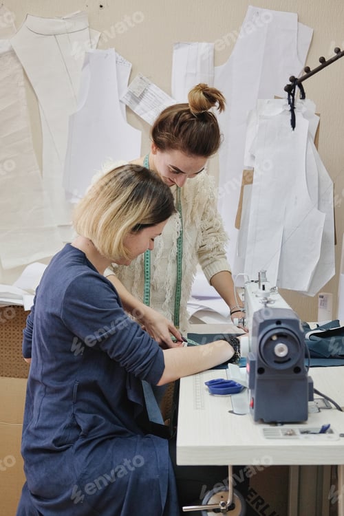 Preview: Female Tailor Working In In The Sewing Workshop.