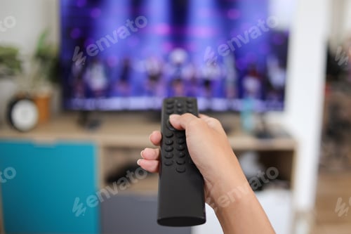 Preview: Hand Pushing Remote Control Watching TV