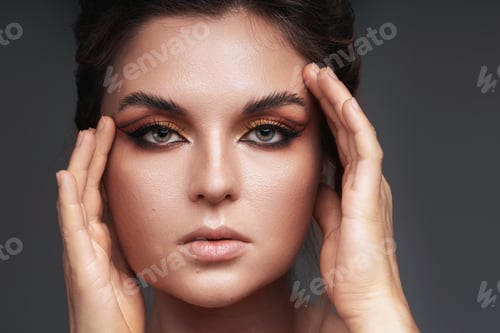 Preview: Woman in Studio Portrait with Bold Eye Makeup