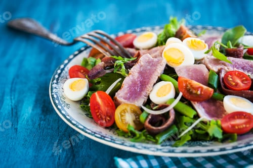 Preview: Tuna salad with tomatoes, boiled eggs, onion, anchovy and lettuc