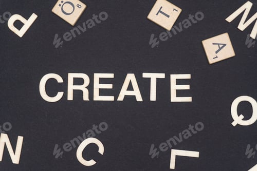 Preview: CREATE word written on dark paper background. CREATE text for your concepts